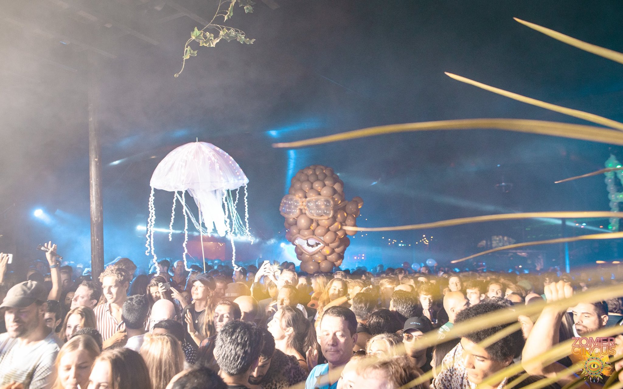 Balloon sculpture of Carl Cox's head with his signature glasses above the night crowd at Thuishaven Amsterdam, 2018 — Spellbound by Out of Thin Air — Photo by Taylor Berkmans
