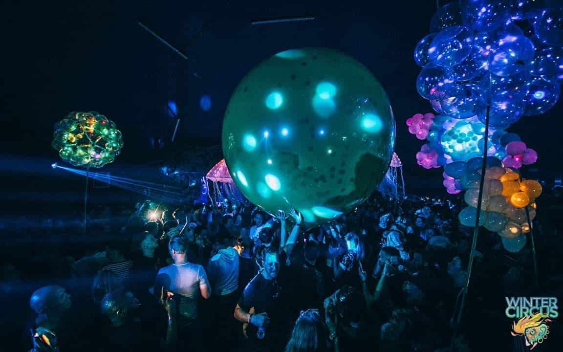Giant glowing green orb balloon clusters with LED lighting at Winter Circus in Amsterdam (2019) — Master Blaster — Float of Thin Air