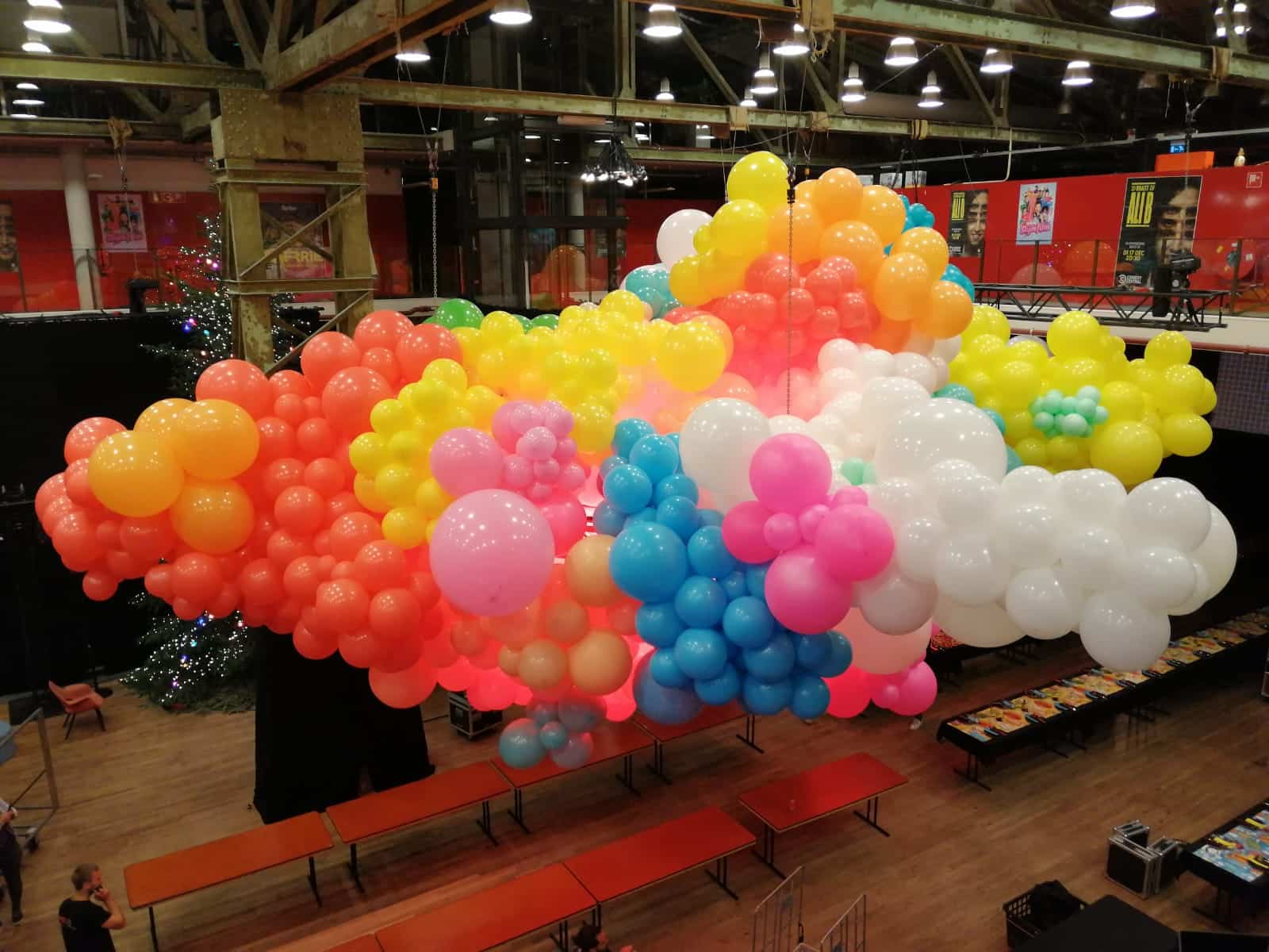 Custom rainbow balloon cloud ceiling installation for Christmas event at VIMN Christmas Lunch in Amsterdam (2019)