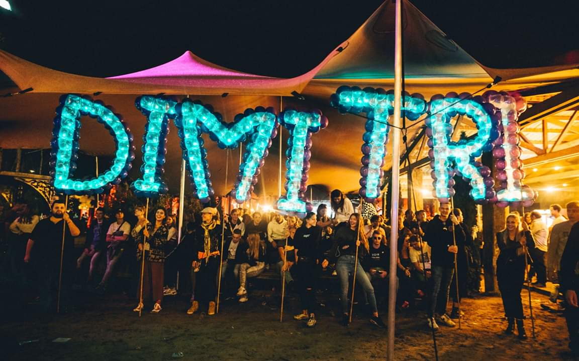 Spellbound LED balloon letters spelling DIMITRI held above the crowd inside the tent at Thuishaven in Amsterdam (2019)