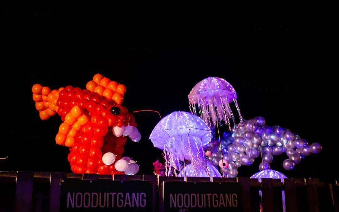 Giant anglerfish and jellyfish balloon sculptures with emergency exit sign at Winter Circus in Amsterdam (2019) — Titans of Air — Float of Thin Air